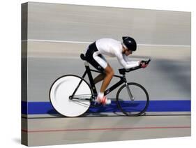 Action of Female Cyclist Competing on the Velodrome-null-Stretched Canvas