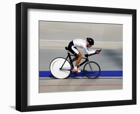 Action of Female Cyclist Competing on the Velodrome-null-Framed Photographic Print