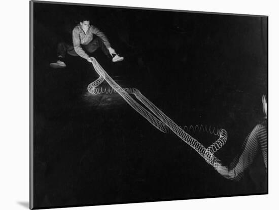 Action of Wave Mechanics of Light and Radio Illustrated by Use of Slinky Toy, MIT-Fritz Goro-Mounted Photographic Print