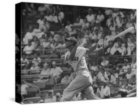 Action Shot of Chicago Cub's Ernie Banks, Following Direction of Baseball Resulting from His Hit-John Dominis-Stretched Canvas