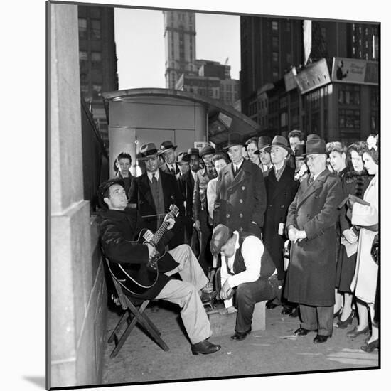 Activist Folk Musician Woody Guthrie Playing for a Crowd of New Yorkers-null-Mounted Premium Photographic Print