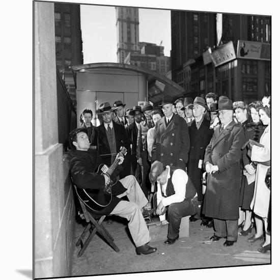 Activist Folk Musician Woody Guthrie Playing for a Crowd of New Yorkers-null-Mounted Premium Photographic Print