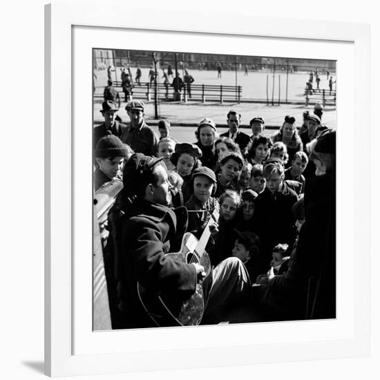 Activist Folk Musician Woody Guthrie Playing for a Crowd of Young New Yorkers in a Park-null-Framed Premium Photographic Print