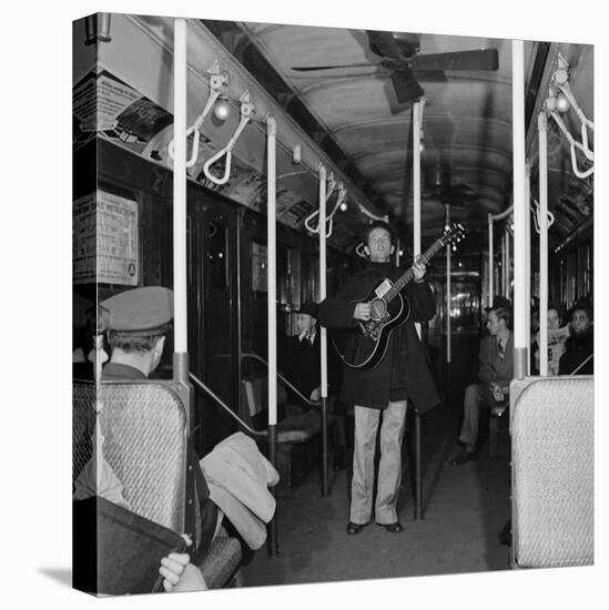 Activist Folk Musician Woody Guthrie Playing for a Subway Car of New Yorkers-Eric Schaal-Stretched Canvas