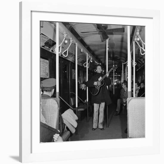 Activist Folk Musician Woody Guthrie Playing for a Subway Car of New Yorkers-Eric Schaal-Framed Premium Photographic Print