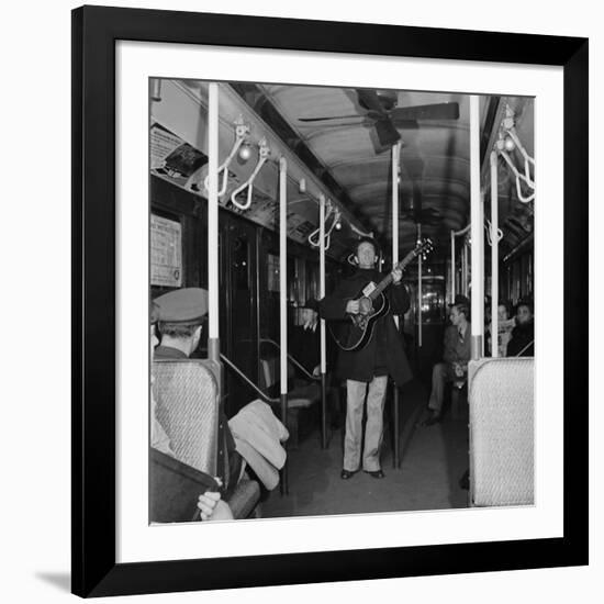 Activist Folk Musician Woody Guthrie Playing for a Subway Car of New Yorkers-Eric Schaal-Framed Premium Photographic Print