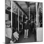 Activist Folk Musician Woody Guthrie Playing for a Subway Car of New Yorkers-Eric Schaal-Mounted Premium Photographic Print