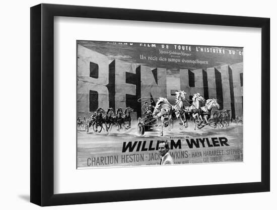 Actor Charlton Heston Posing in Front of Billboard of Film, Ben Hur-null-Framed Photographic Print