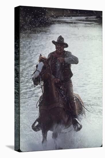 Actor John Wayne During Filming of Western Movie "The Undefeated"-John Dominis-Stretched Canvas