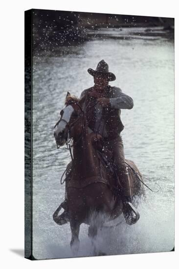 Actor John Wayne During Filming of Western Movie "The Undefeated"-John Dominis-Stretched Canvas