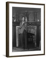 Actor Leslie Howard Smoking Pipe as He Stands by His Fireplace, at Home in Dorking, England-null-Framed Premium Photographic Print