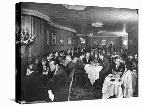 Actor Orson Welles at Table on Left with Cigar in His Mouth-Alfred Eisenstaedt-Stretched Canvas