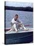 Actor Paul Newman Enjoying a Heineken Beer on the Prow of a Boat-Mark Kauffman-Stretched Canvas