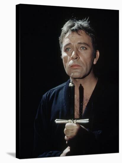 Actor Richard Burton Gripping Hilt of Sword During Scene from "Hamlet" on Broadway-George Silk-Stretched Canvas