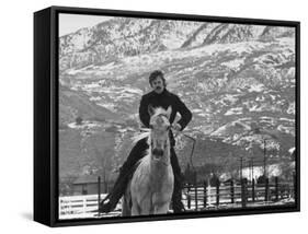 Actor Robert Redford Exercising One of His Eight Saddle Horses on His Remote Mountain Ranch-John Dominis-Framed Stretched Canvas