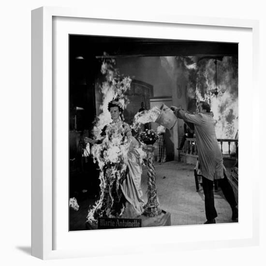 Actor Vincent Price Putting Out Fire in Film "House of Wax"-J^ R^ Eyerman-Framed Premium Photographic Print