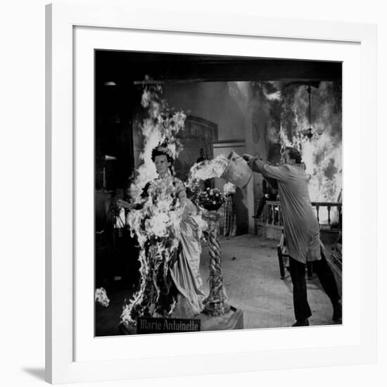 Actor Vincent Price Putting Out Fire in Film "House of Wax"-J^ R^ Eyerman-Framed Premium Photographic Print