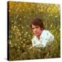 Actor Warren Beatty Sitting in Field of Flowers-Ralph Crane-Stretched Canvas