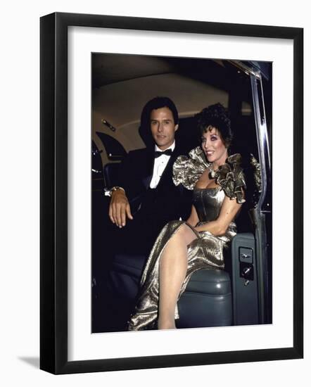 Actors Michael Nader and Joan Collins Sitting in a Car-John Paschal-Framed Premium Photographic Print