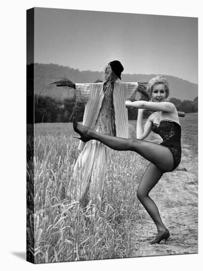 Actress and Dancer Julie Newmar Warming Up for Her Devil's Role in the Musical "Damn Yankees"-Nina Leen-Stretched Canvas