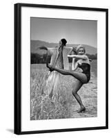 Actress and Dancer Julie Newmar Warming Up for Her Devil's Role in the Musical "Damn Yankees"-Nina Leen-Framed Premium Photographic Print