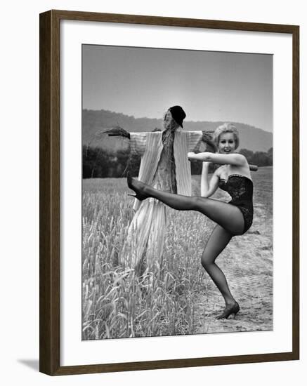 Actress and Dancer Julie Newmar Warming Up for Her Devil's Role in the Musical "Damn Yankees"-Nina Leen-Framed Premium Photographic Print