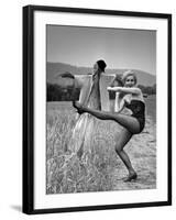 Actress and Dancer Julie Newmar Warming Up for Her Devil's Role in the Musical "Damn Yankees"-Nina Leen-Framed Premium Photographic Print