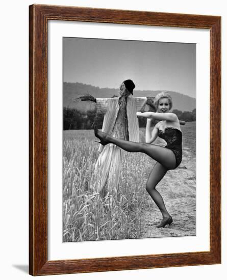 Actress and Dancer Julie Newmar Warming Up for Her Devil's Role in the Musical "Damn Yankees"-Nina Leen-Framed Premium Photographic Print