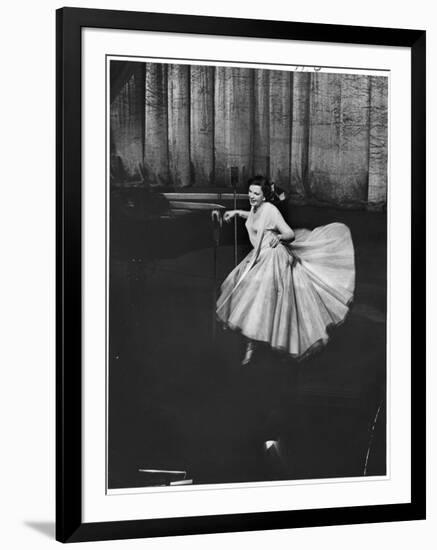 Actress and Singer Judy Garland Twirling Into a Dance Step During a Performance at the Palladium-Cornell Capa-Framed Photographic Print