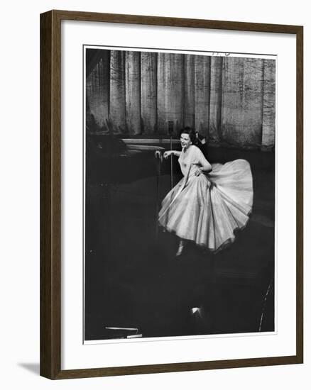 Actress and Singer Judy Garland Twirling Into a Dance Step During a Performance at the Palladium-Cornell Capa-Framed Photographic Print