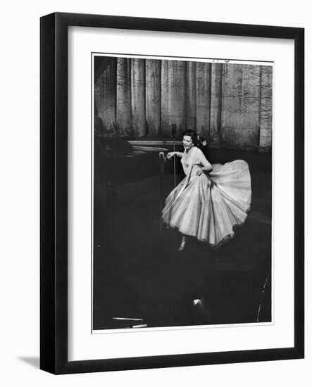 Actress and Singer Judy Garland Twirling Into a Dance Step During a Performance at the Palladium-Cornell Capa-Framed Photographic Print