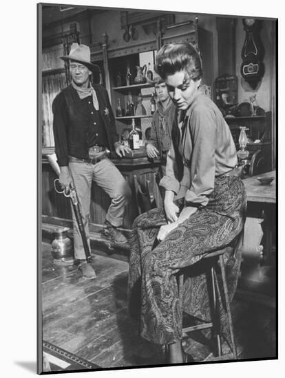 Actress Angie Dickinson on Set for "Rio Bravo" with Actor John Wayne-Allan Grant-Mounted Premium Photographic Print