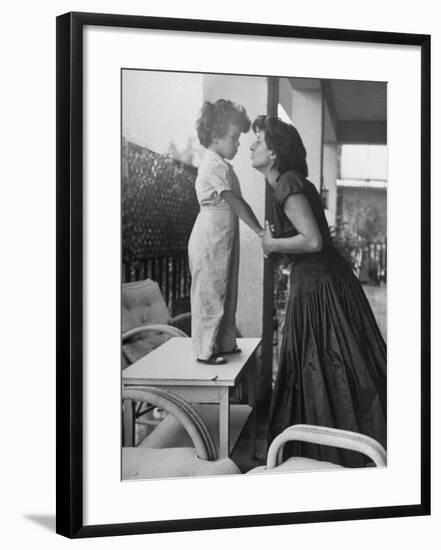 Actress Anna Magnani Posing with Child Standing on Table-null-Framed Premium Photographic Print