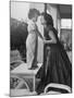 Actress Anna Magnani Posing with Child Standing on Table-null-Mounted Premium Photographic Print