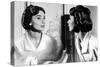 Actress Audrey Hepburn Looking at Her Reflection in the Mirror January 16, 1957-null-Stretched Canvas