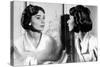 Actress Audrey Hepburn Looking at Her Reflection in the Mirror January 16, 1957-null-Stretched Canvas