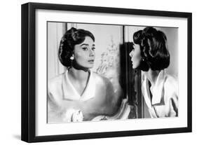 Actress Audrey Hepburn Looking at Her Reflection in the Mirror January 16, 1957-null-Framed Photo