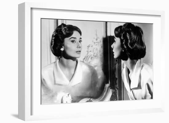 Actress Audrey Hepburn Looking at Her Reflection in the Mirror January 16, 1957-null-Framed Photo