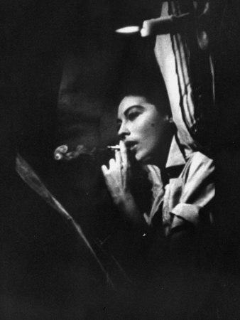 https://imgc.allpostersimages.com/img/posters/actress-ava-gardner-smoking-a-cigarette-in-a-scene-from-the-film-mogambo_u-L-P76QQV0.jpg?artPerspective=n