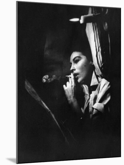 Actress Ava Gardner Smoking a Cigarette in a Scene from the Film "Mogambo"-Peter Stackpole-Mounted Premium Photographic Print