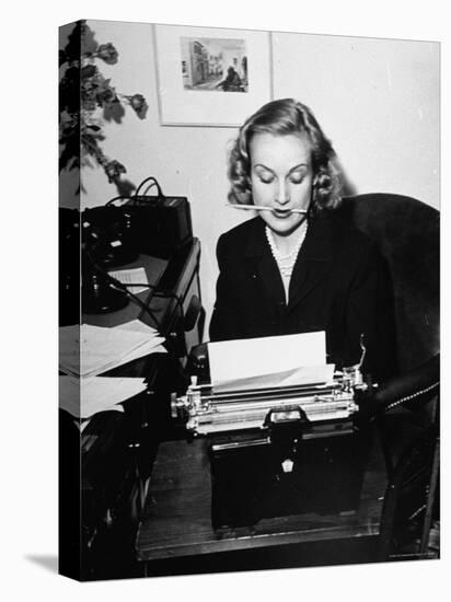 Actress Carole Lombard Typing While Holding Pencil Firmly in Her Mouth-Rex Hardy Jr.-Stretched Canvas