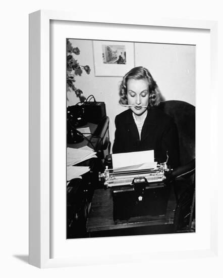 Actress Carole Lombard Typing While Holding Pencil Firmly in Her Mouth-Rex Hardy Jr.-Framed Premium Photographic Print