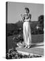 Actress Claudette Colbert Holding Cigarette as She Suns Herself on Terrace of Her Holmby Hills Home-Alfred Eisenstaedt-Stretched Canvas