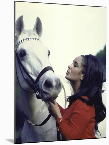 Actress Elizabeth Taylor with Horse During Filming of "Reflections in a Golden Eye"-Loomis Dean-Mounted Premium Photographic Print