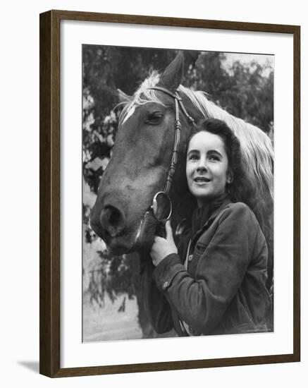 Actress Elizabeth Taylor with Saddle Horse After Her Smash Movie Debut in "National Velvet"-Peter Stackpole-Framed Premium Photographic Print