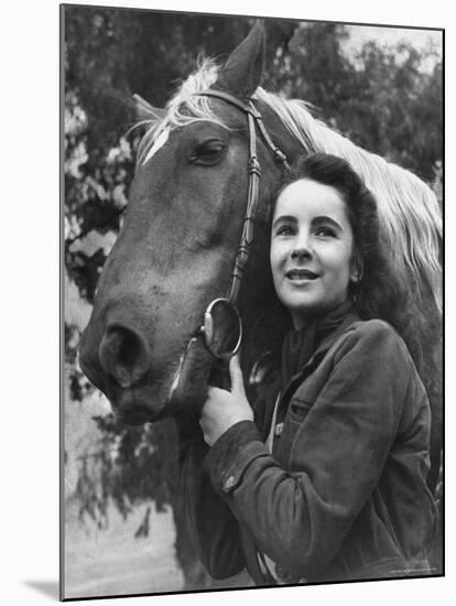 Actress Elizabeth Taylor with Saddle Horse After Her Smash Movie Debut in "National Velvet"-Peter Stackpole-Mounted Premium Photographic Print