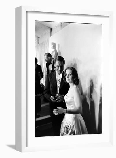 Actress Gene Simmons and Cary Grant Backstage at the 30th Academy Awards, 1958-Ralph Crane-Framed Photographic Print