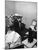 Actress Grace Kelly Packing for Wedding to Prince Rainer of Monaco While Pet Poodle Looks On-Lisa Larsen-Mounted Premium Photographic Print