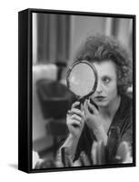 Actress Hanna Schygulla Looking in Hand Mirror While Applying Makeup-Alfred Eisenstaedt-Framed Stretched Canvas