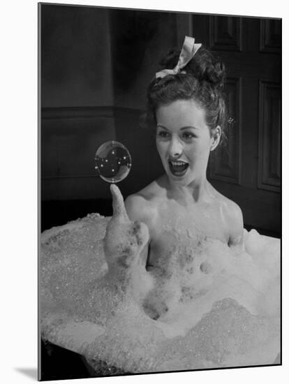 Actress Jeanne Crain Taking Bubble Bath for Her Role in Movie "Margie"-Peter Stackpole-Mounted Premium Photographic Print